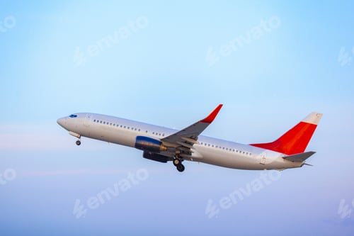 Preview: Passenger plane taking off from runway at airport on sunny day