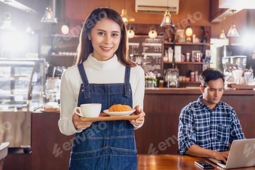 Preview: Asian Barista of Small business owner serving a cup of coffee and Croissants bakery