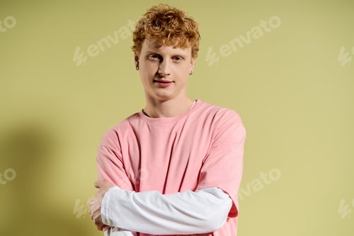 Preview: Young stylish man exuding confidence in a vibrant indoor setting during daylight hours