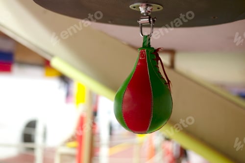 Preview: Green and red punching bag at boxing gym