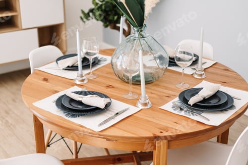 Preview: Served dining table in a modern Scandinavian kitchen.