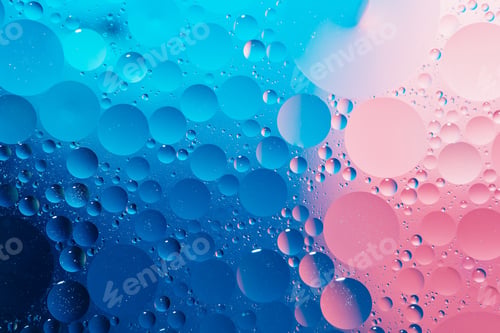 Preview: oil with bubbles on vibrant blue and pink background. Abstract background