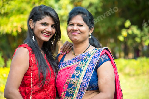 Preview: Portrait of happy mother and daughter embracing.