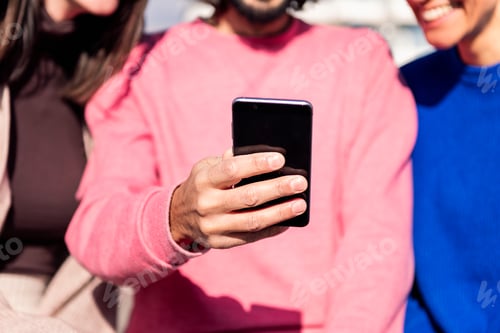 Preview: hand with mobile phone sharing with friends