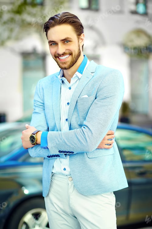 Preview: Handsome man in suit posing outdoors