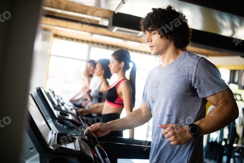 Preview: Young people running on a treadmill in health club