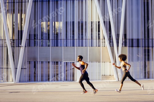 Preview: athletic latin woman and sports man running fast