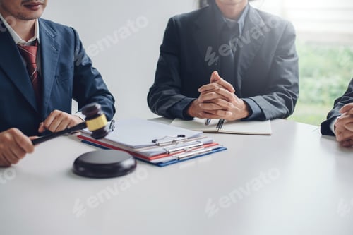 Preview: Business lawyer working about legal legislation in courtroom to help their customer.