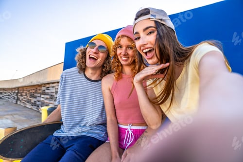 Preview: Group of cheerful skaters taking a selfie after a skating session