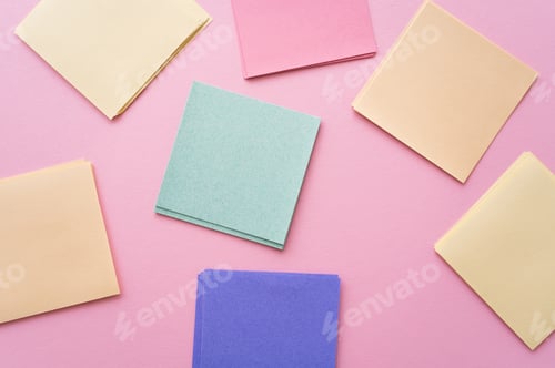Preview: top view of colorful and blank paper notes on pink