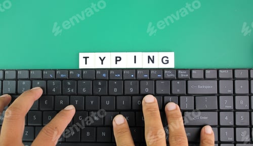 Preview: fingers press letters on laptop keyboard with word typing