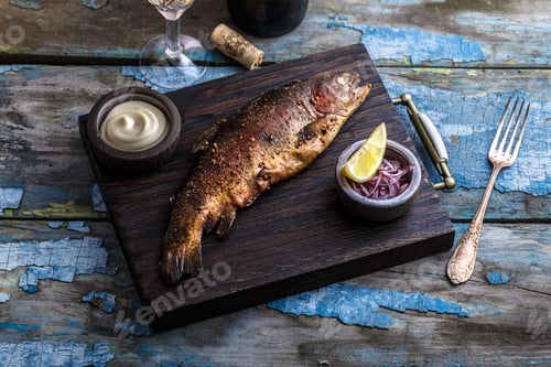 Preview: Smoked trout with spices on a stone tray.