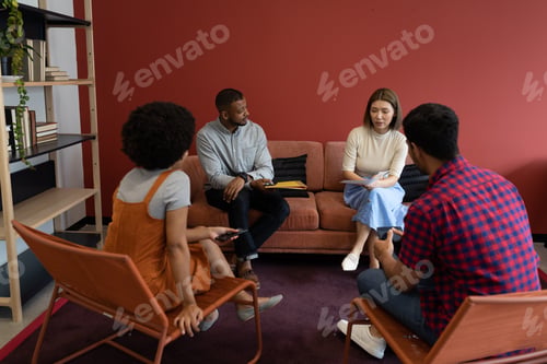 Preview: Diverse group of business people working in creative office