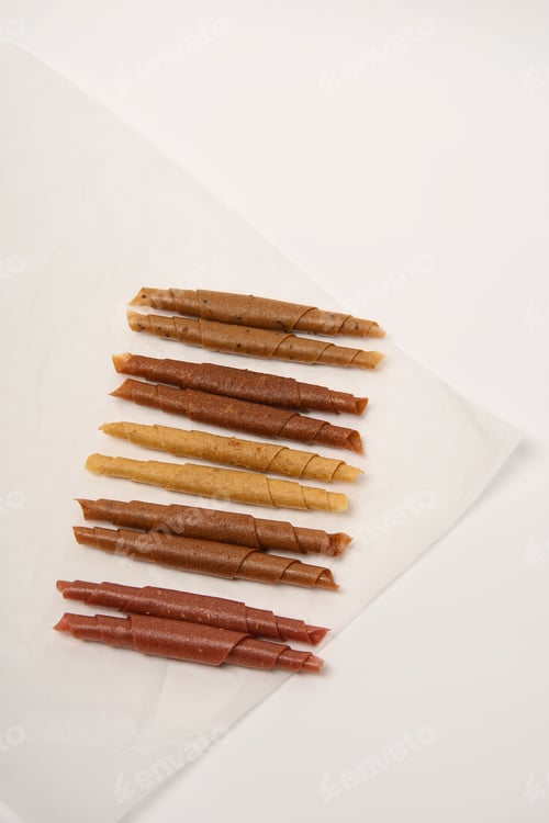 Preview: Pattern pastila fruit leather rolls up with fruits on white background. Vertically.