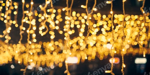 Preview: Yellow lights bokeh from christmas holiday garlands, blurred festive background, abstract lights