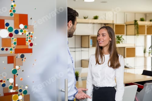 Preview: Young business people in modern office