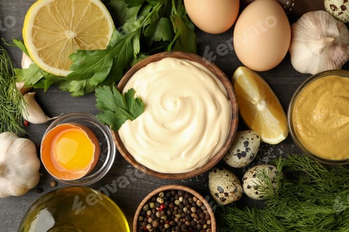 Preview: Wooden bowl of mayonnaise and ingredients for cooking, top view