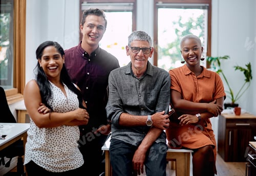 Preview: Portrait of a group of businesspeople standing together in an office