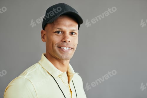 Preview: Portrait of happy African American male coach looking at camera.