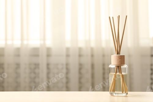 Preview: Reed air freshener on table indoors, space for text