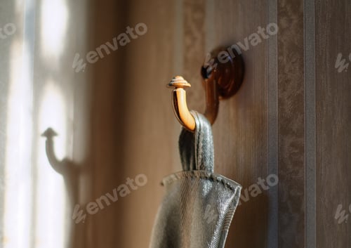 Preview: Wooden Hook Holding Gray Cloth with Light Shadow