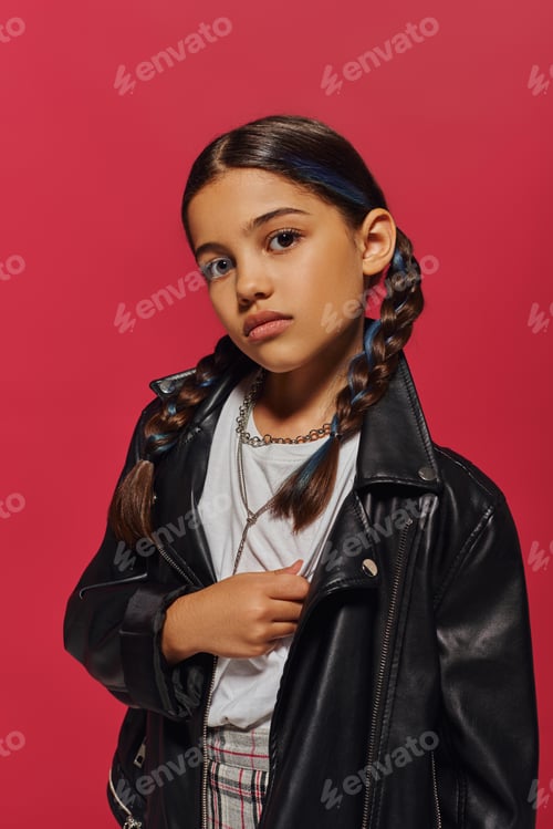 Preview: Portrait of confident and trendy preadolescent girl with dyed hair and hairstyle posing