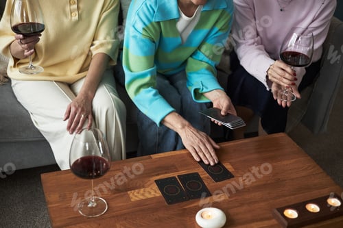 Preview: Three Caucasian Adult Women Drinking Wine and Reading Tarot Cards Together