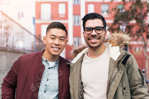 Preview: Portrait of group of friends looking the camera in the street.