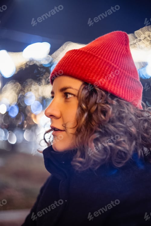 Preview: curly young woman at night at the fair