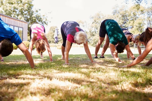 Preview: Female Instructor Leading Outdoor Yoga Class
