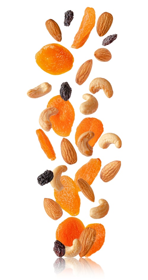 Preview: Flying dry fruits and nuts isolated on white.