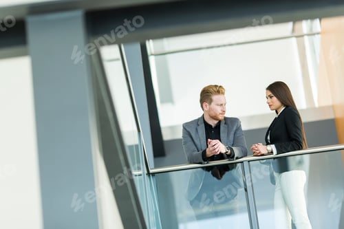 Preview: Young couple working in the office