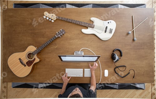 Preview: Top view of musician in the process of recording music in the studio.