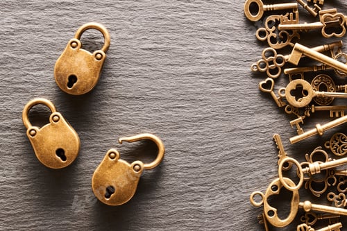 Preview: Various metal keys and locks on slate background