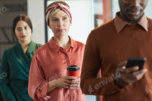 Preview: Business People Standing in Line in Office