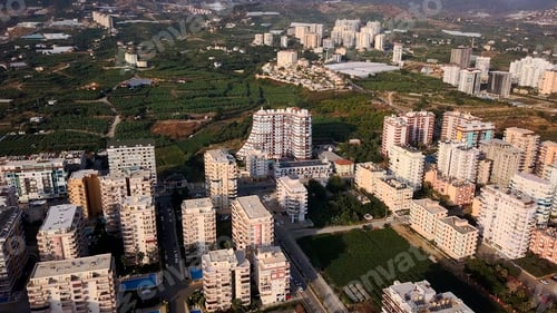 Preview: Aerial view of a city with many woman. Clip. Summer green city in a morning haze.