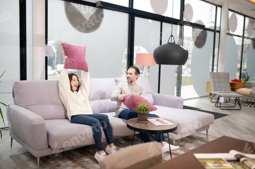 Preview: Feeling Good. Couple Sitting On The Cosy Beautiful Sofa And Enjoying