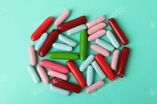 Preview: Gummy candies on mint background, top view