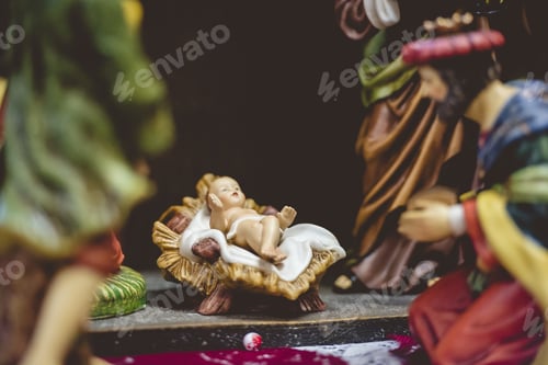 Preview: Selective closeup shot of figurines of religious saints and a newborn baby