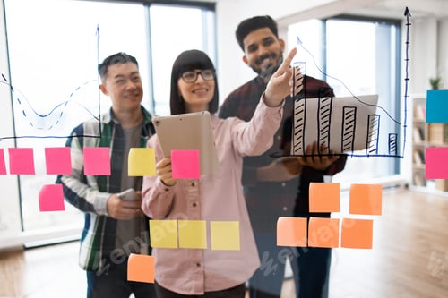 Preview: Creative team brainstorming with charts and sticky notes