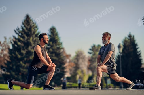 Preview: The young and old athletes stretching outdoor.