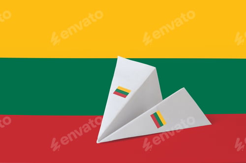 Preview: Lithuania flag depicted on paper origami airplane. Oriental handmade arts concept