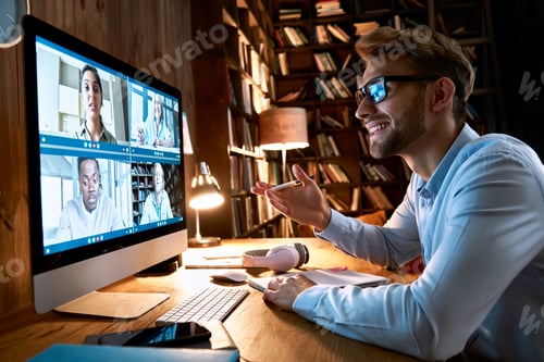 Preview: Businessman having virtual team meeting on video conference call using computer.