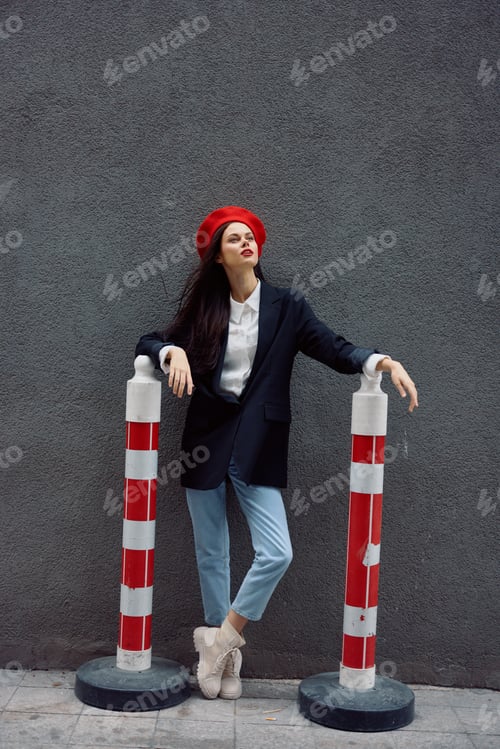 Preview: Fashion woman standing on the street in front of the city and road works tourist in stylish clothes