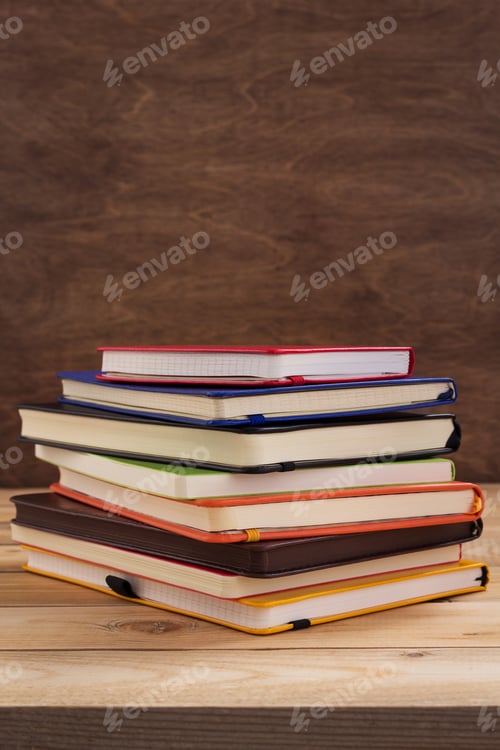 Preview: notepad or paper notebook at wooden table