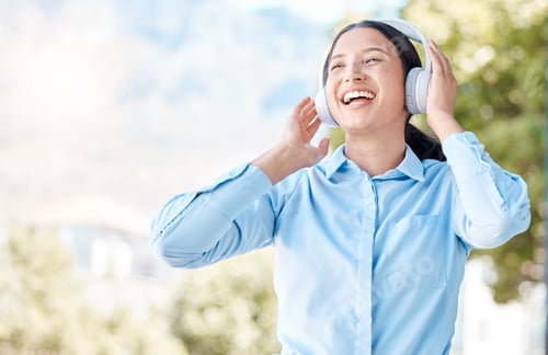 Preview: Woman with headphones happy listening to music on mp3 audio streaming song app singing to popular s