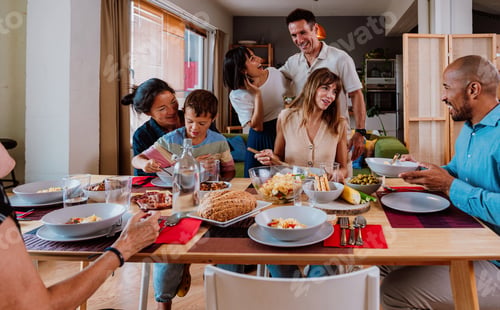 Preview: Family and friends reunion at home. Happy multigenerational family enjoying meal together at home