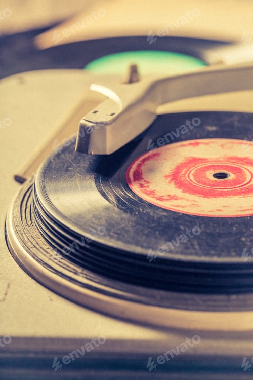 Preview: Retro gramophone with few scratched vinyl records.