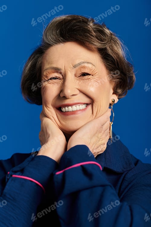 Preview: A beautiful woman in her 60s showcases her fashionable attire with confidence and grace.