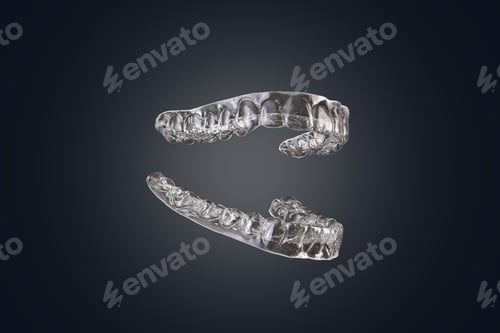 Preview: Transparent silicone orthodontic braces for aligning the denture isolated on black